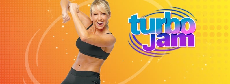 Chalene Johnson in a black top is dancing - tubro jam