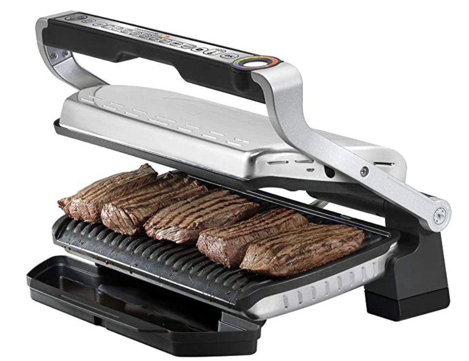 a grill that has some steaks on it